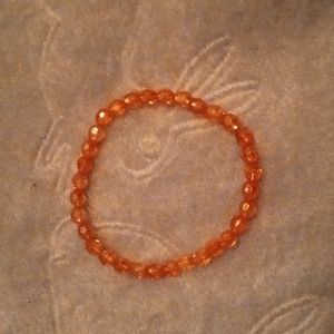 Minimalist handmade shiny and iridescent fun casual orange bracelet